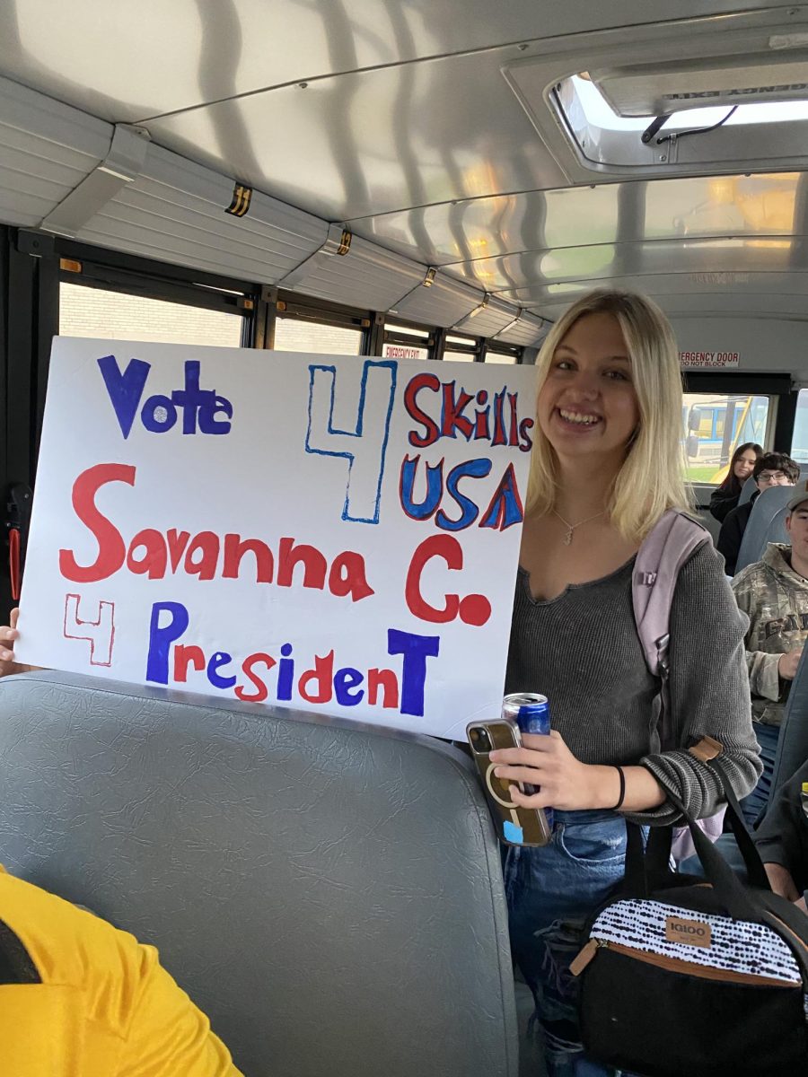 Savanna Compton poses with her campaign sign.