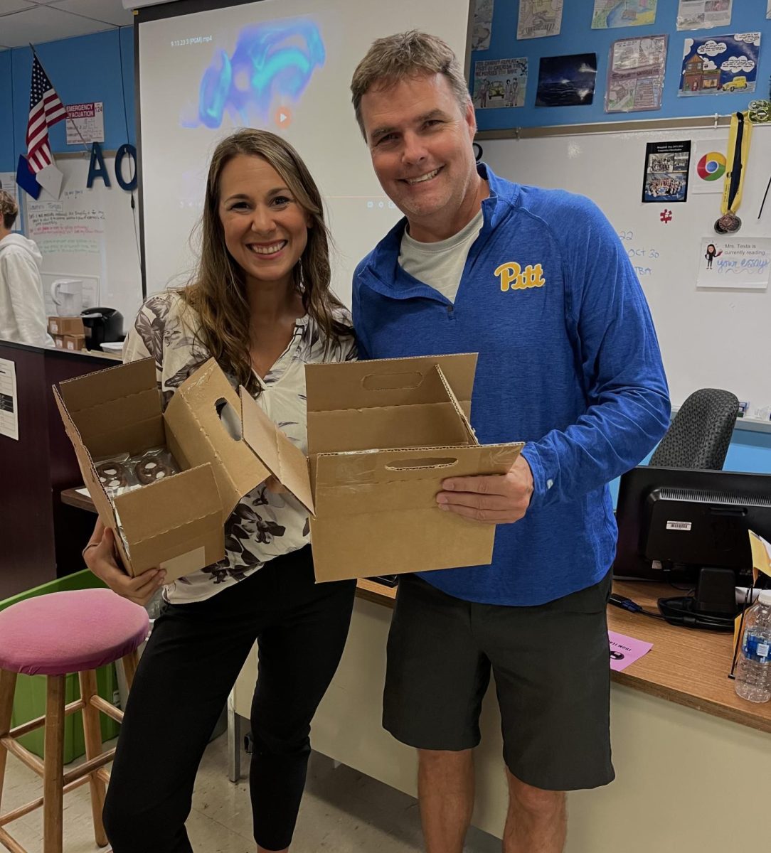 Mrs. Testa and Mr. Boyd, with boxes of chocolate grahams, ready for Hempfield students to buy!