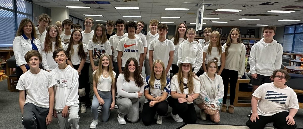 Freshmen in their white out spirit wear.