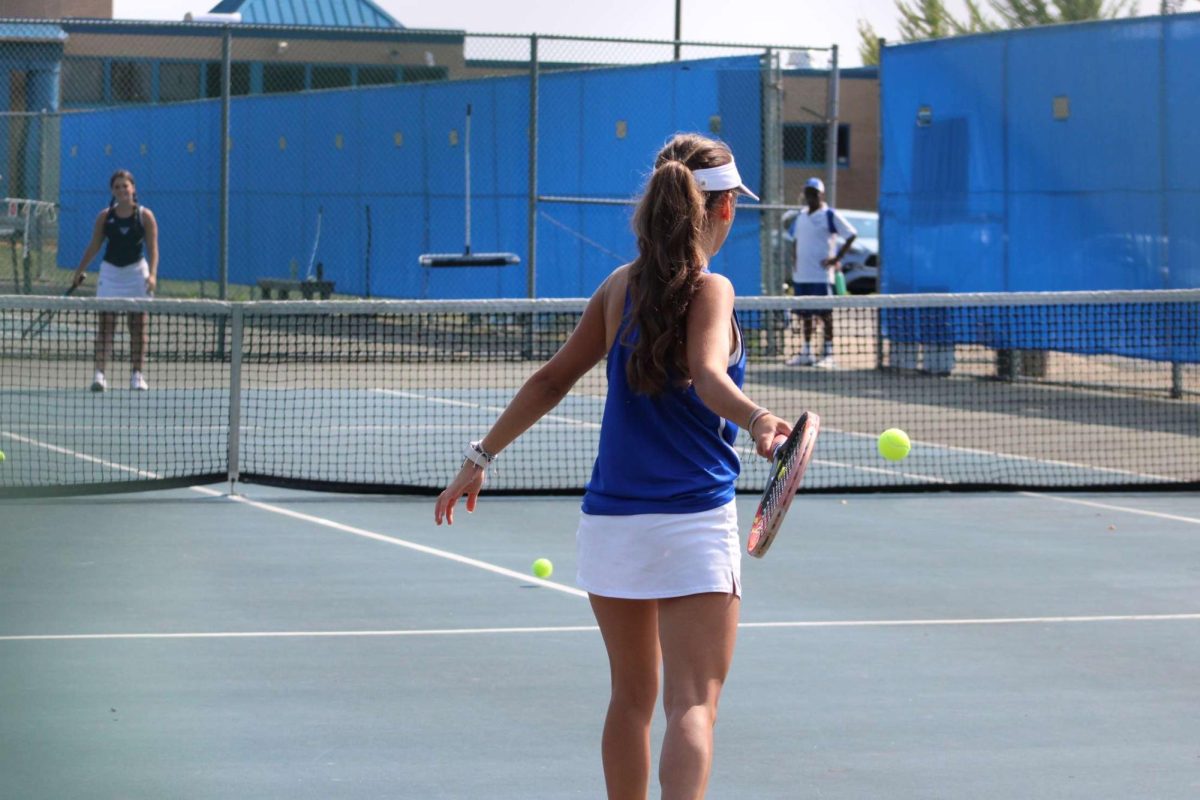 Giana Novotney showcasing her tennis skills.