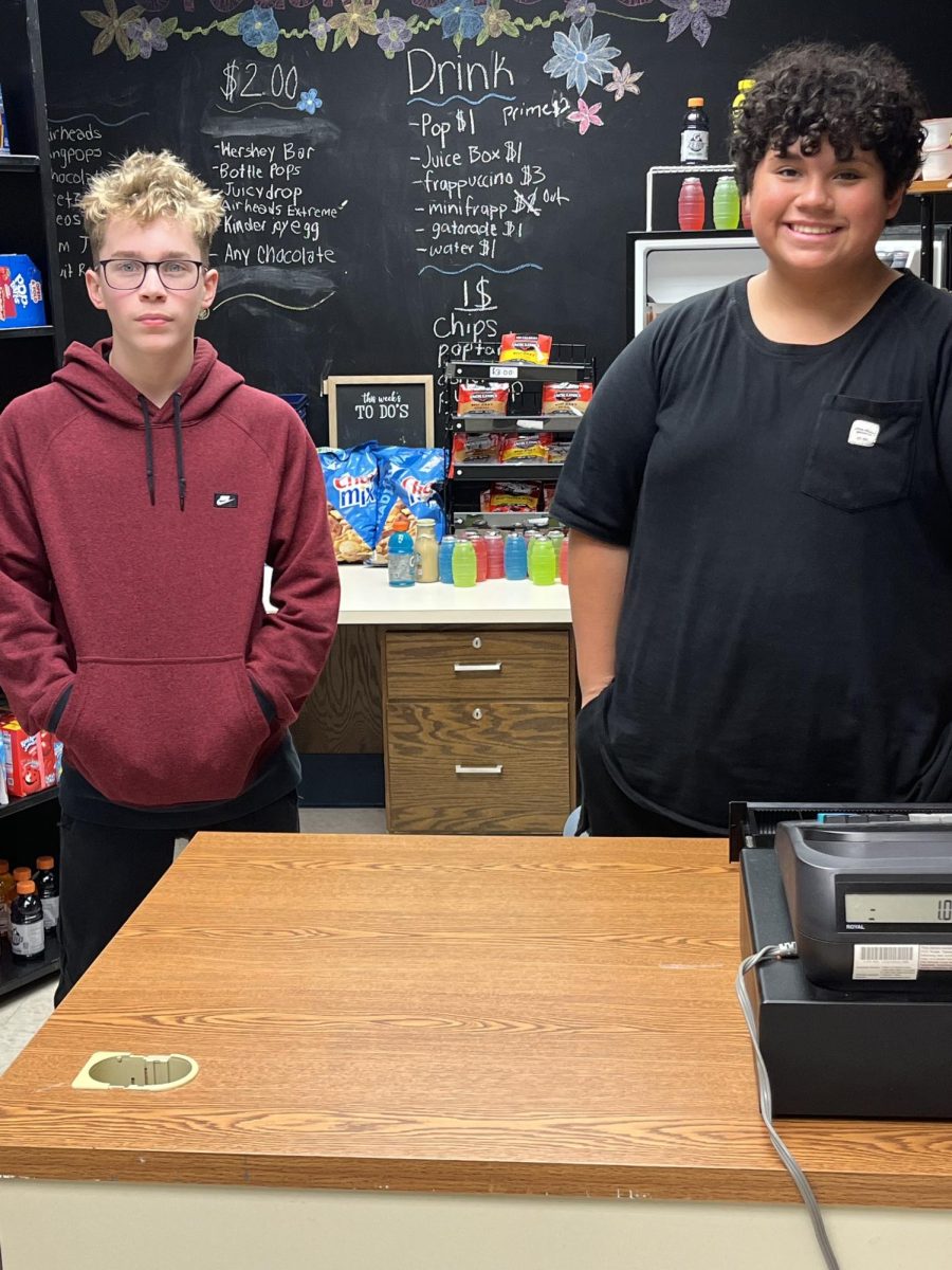 Students pose while working at the Harrold School Store.