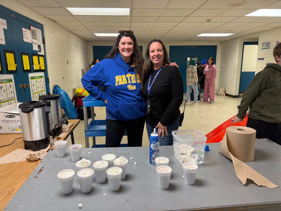 Teachers serving hot cocoa